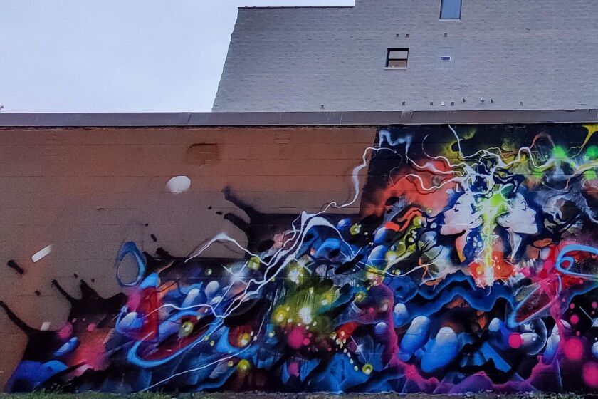 Graffiti art by Joos on a building along Grand Avenue.
