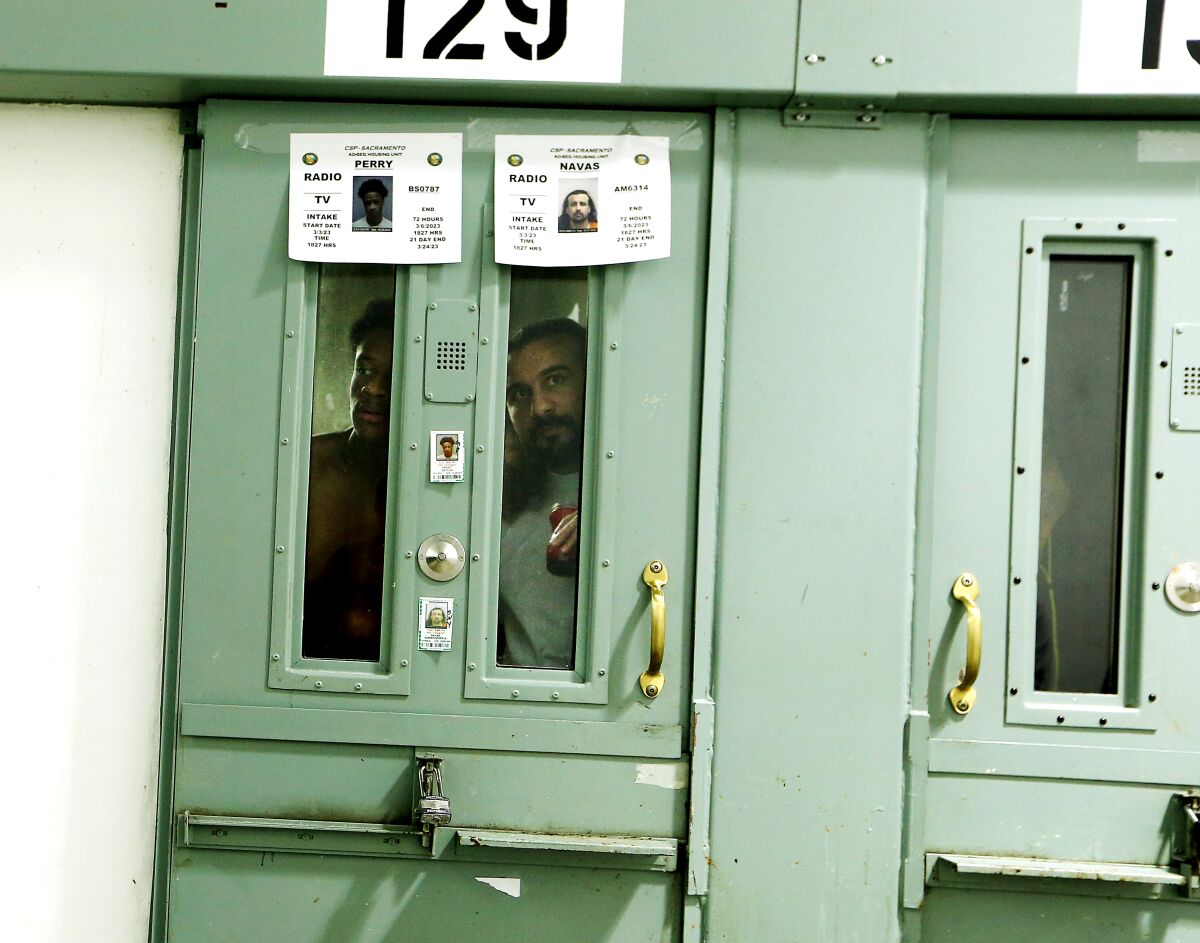 Prisoners are confined in a cell at California State Prison, Sacramento.