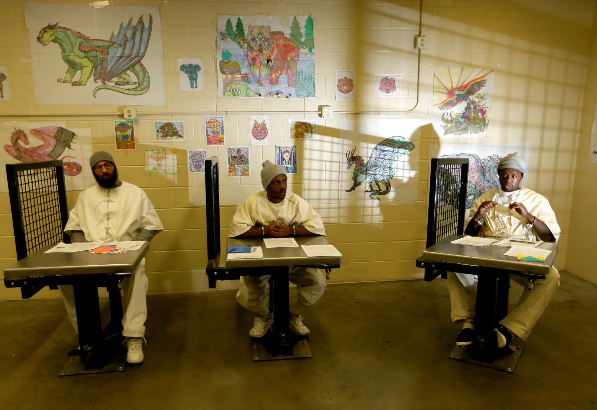 Prisoners attend a class for mental health at California State Prison, Sacramento.