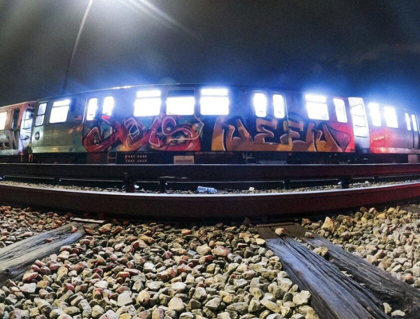An L train painted by Joos (left) and his friend Neen.