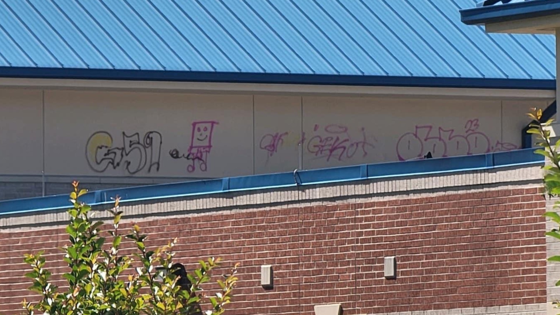 The graffiti was discovered by a teacher Saturday morning. A group of male suspects were seen on the school’s rooftop, but haven't been identified.