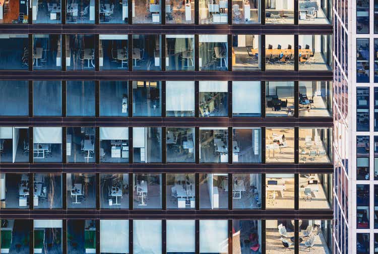 Corporate building facade in windows of glass and steel