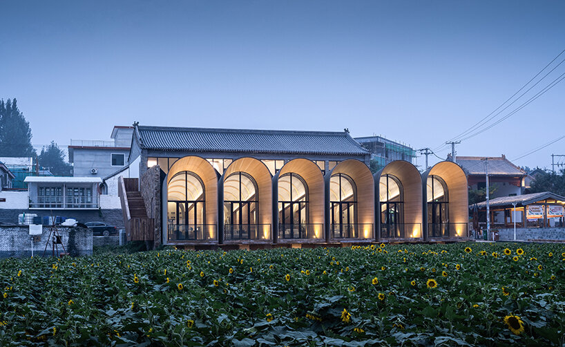 sculptural and rhythmic, these arched concrete volumes enliven the chinese countryside