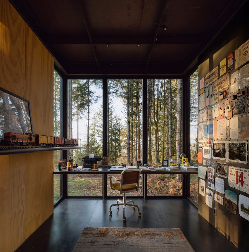 Desk with woods through windows