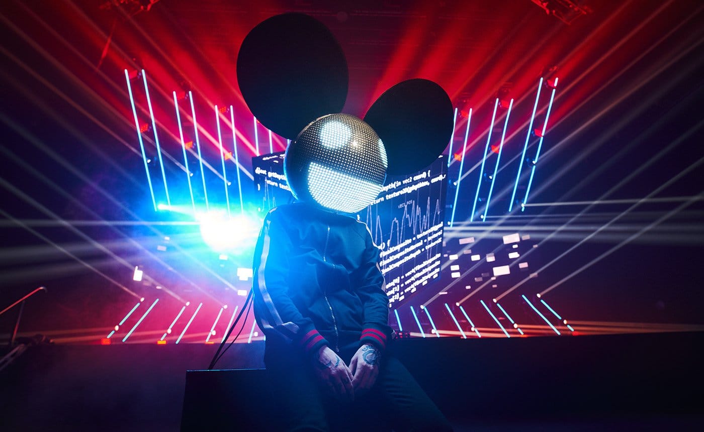 image of deadmau5 sitting in front of a stage with lasers, for his NFT