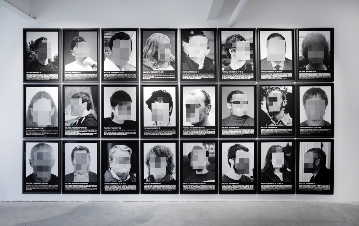 A grid of black-and-white blurred faces.