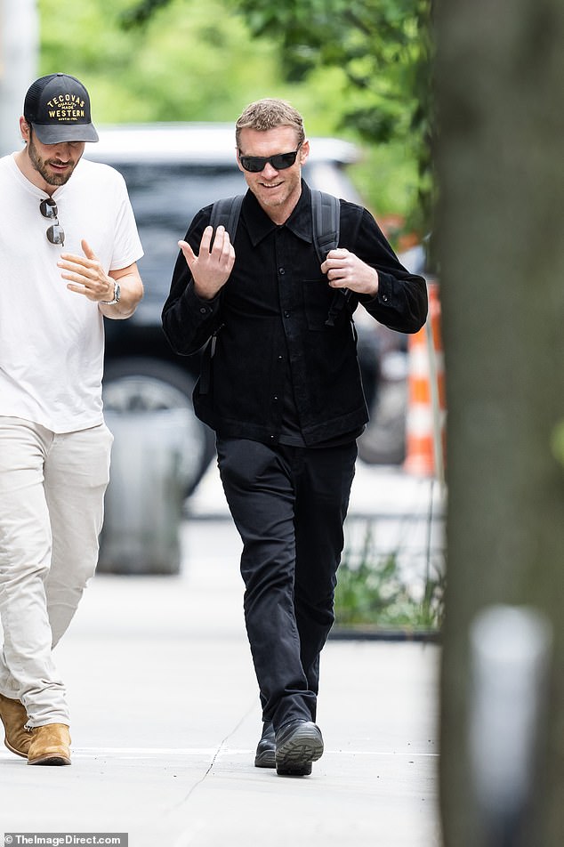 Sam, 46, dressed head-to-toe in black and smiled as he chatted with Million Dollar Listing New York star Steve Gold, 38