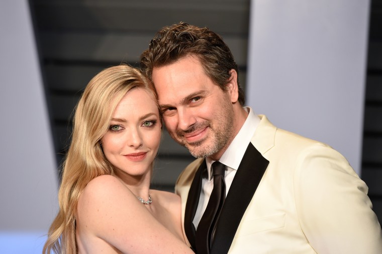 Amanda Seyfried and Thomas Sadoski attends the 2018 Vanity Fair Oscar Party Hosted By Radhika Jones - Arrivals at Wallis Annenberg Center for the Performing Arts on March 4, 2018 in Beverly Hills, CA.