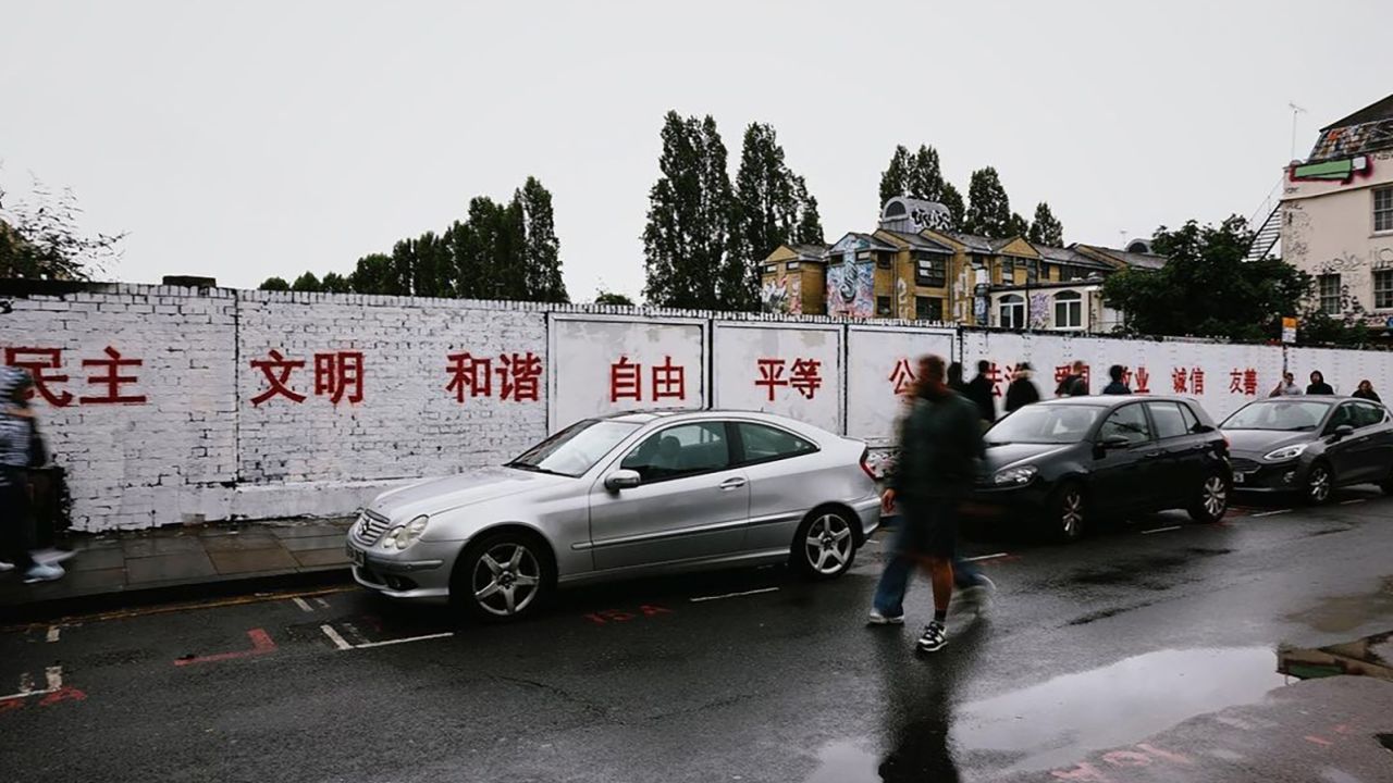 A grafitti wall in Brick Lane was whitewashed and painted over with red slogans promoting China's 