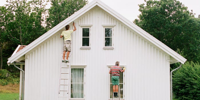 Men painting a house home repairs paint