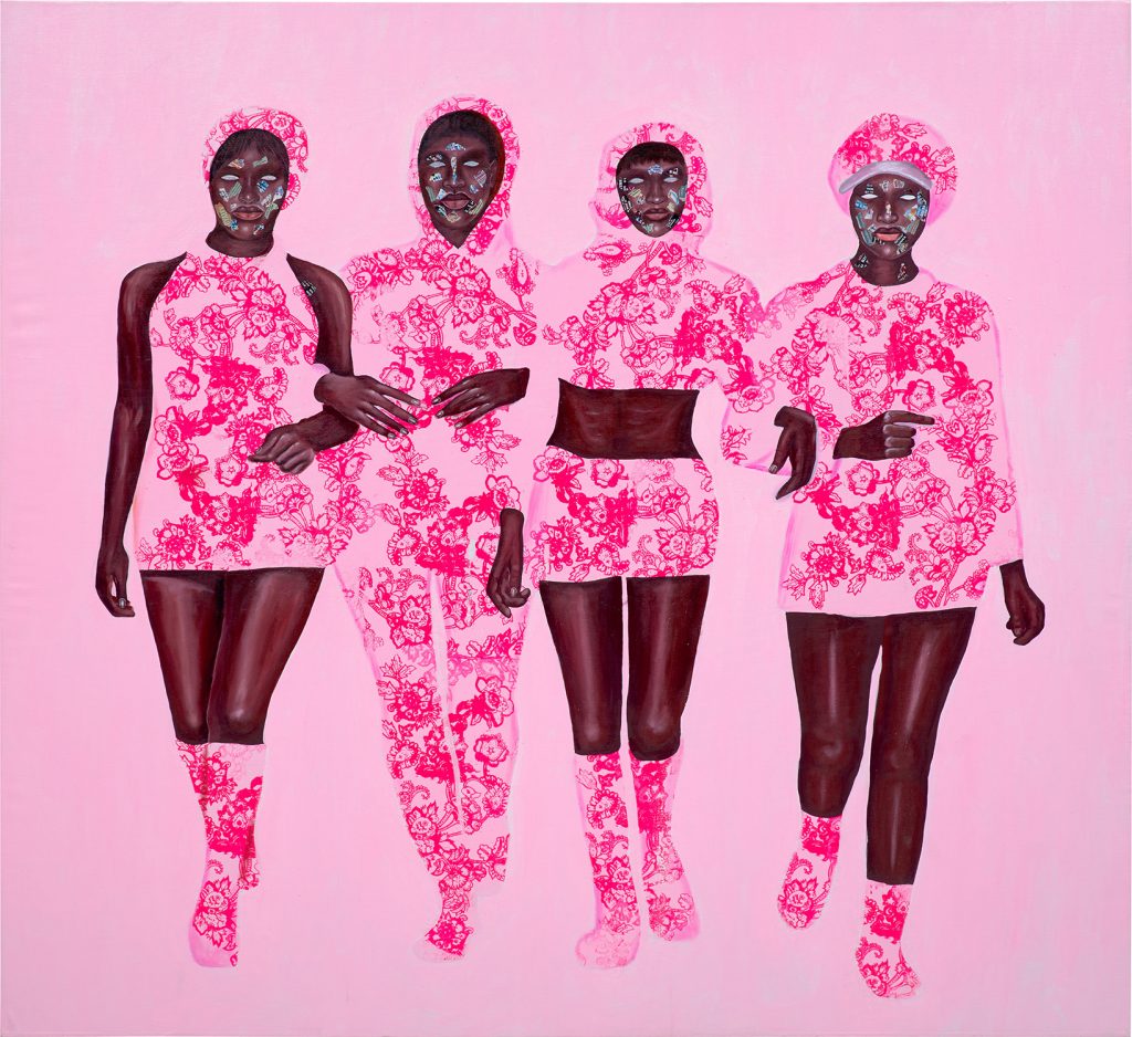 Four Black women in hot pink clothes on pink background
