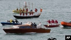 Pope Francis is greeted by gondoliers upon his arrival in Venice, April 28, 2024.