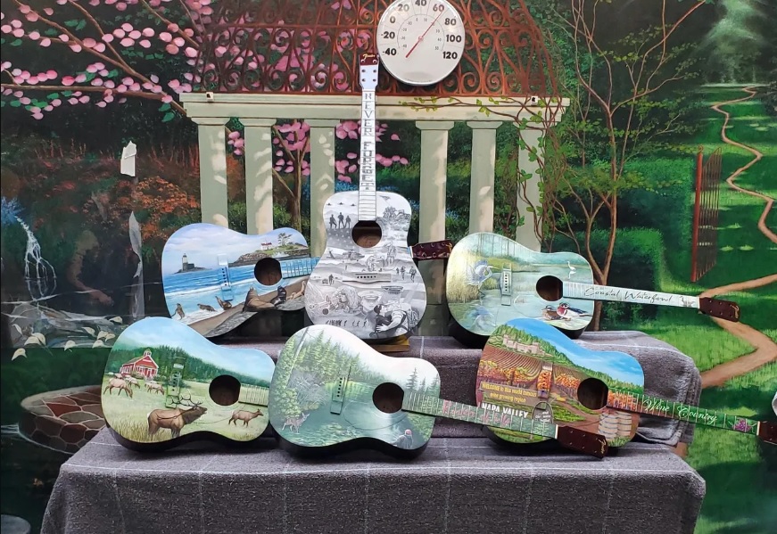 Pelican Bay artists hand painted six Guitars of Hope for an auction to benefit kids.